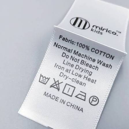 Roll of custom printed care instruction labels