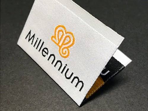 Premium woven label stitched on a designer garment